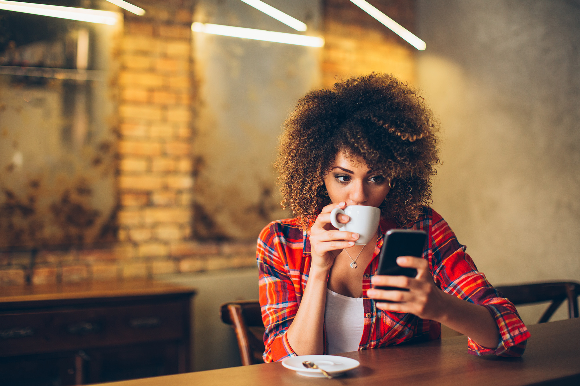 Women drinking coffee and at cafe near Asher Apartments in Texas