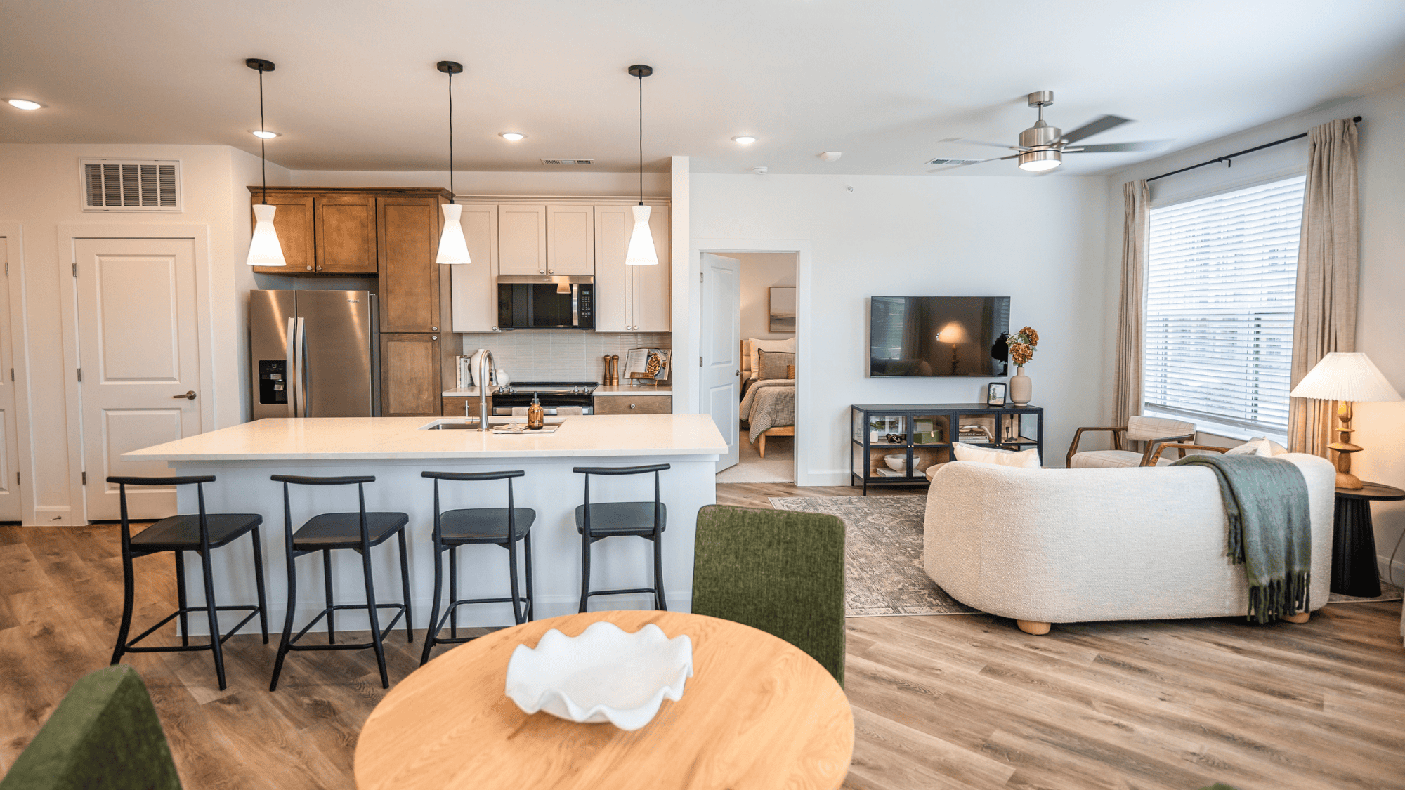 Modern kitchen with dining table setup.